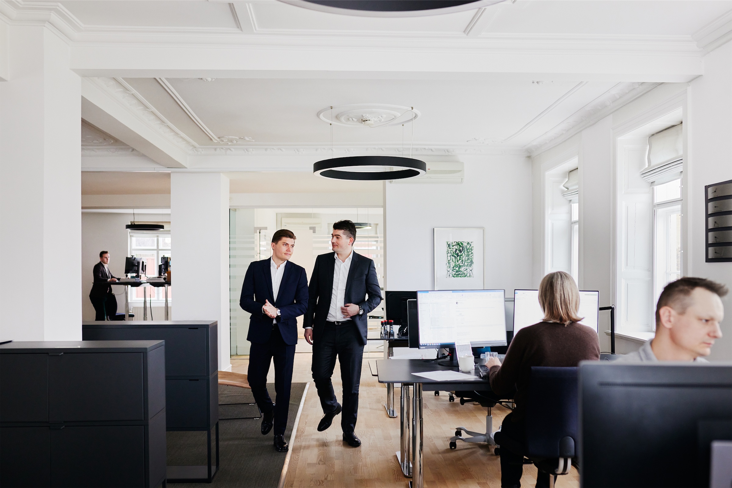 Christian Dam Olesen and his brother Phillip Olesen walk through the HR office of Chr. Olesen in Copenhagen