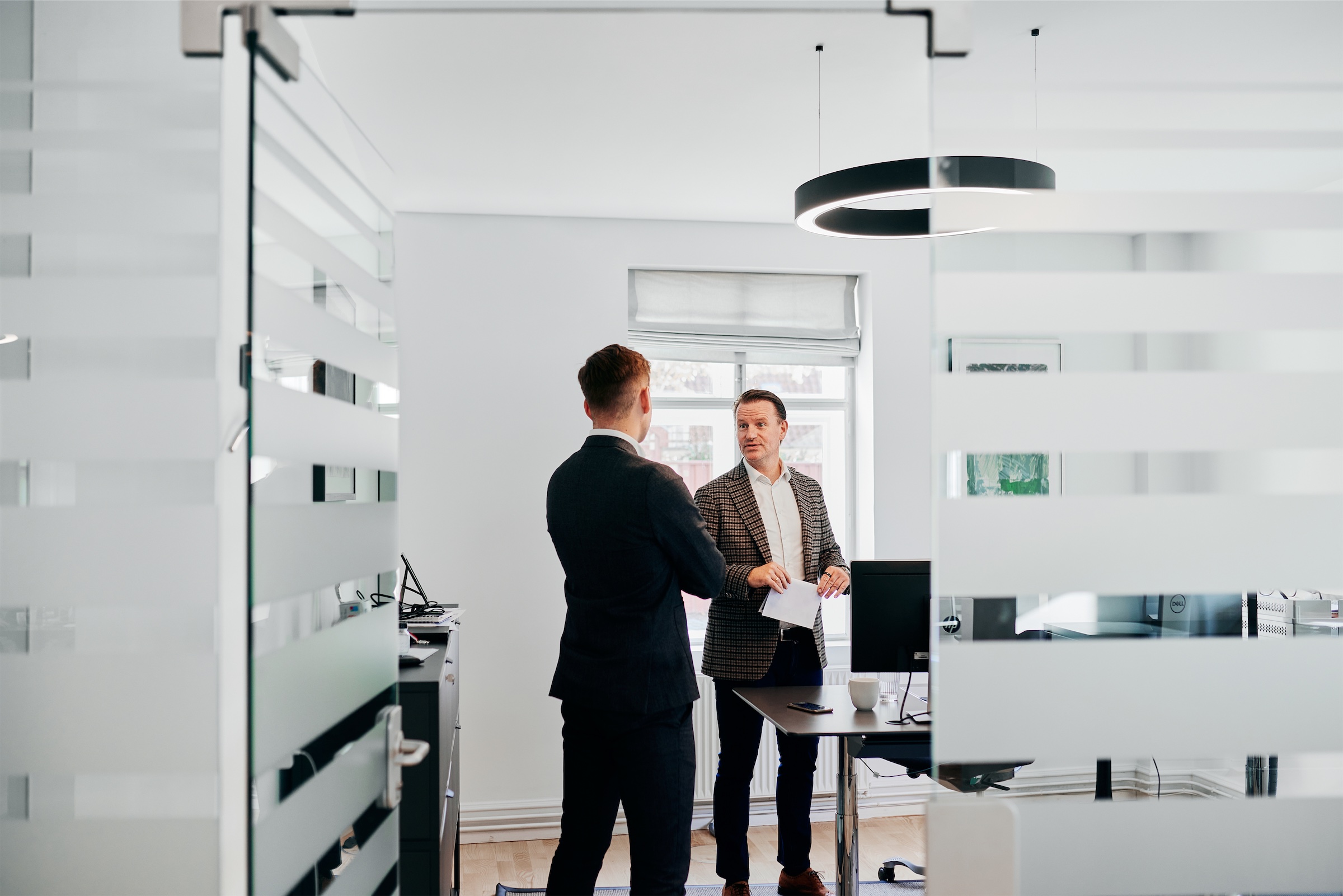 Steen Astrup having a chat with his colleague at the office in Copenhagen